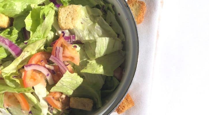 salad. simple salad, salad with croutons, lettuce, tomatoes, red onion