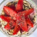 Strawberry overnight oats in a bonne mamam jam jar.