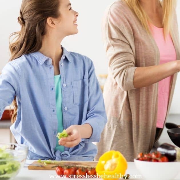 girl helping mom make healthy food