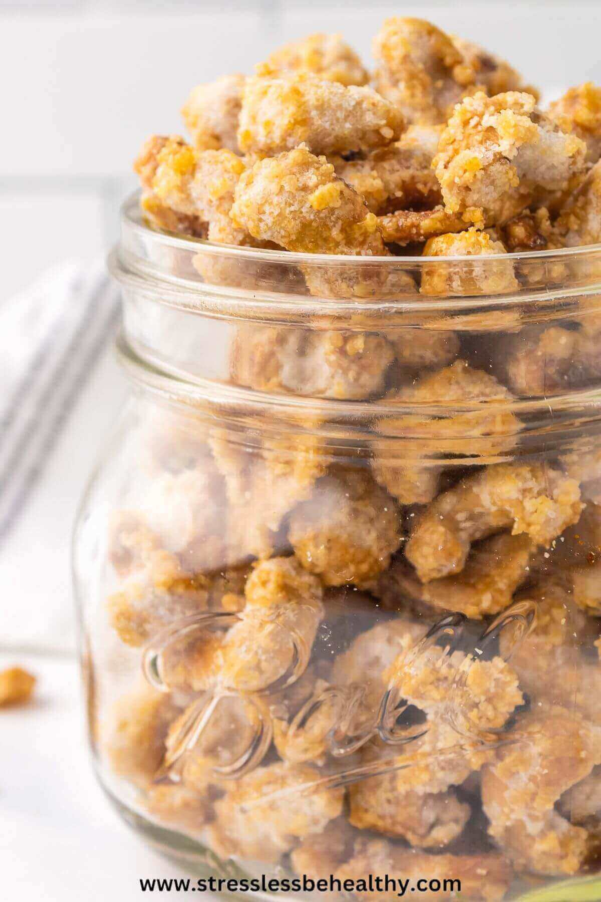 Vegan candied cashews in a wide mouth mason jar.