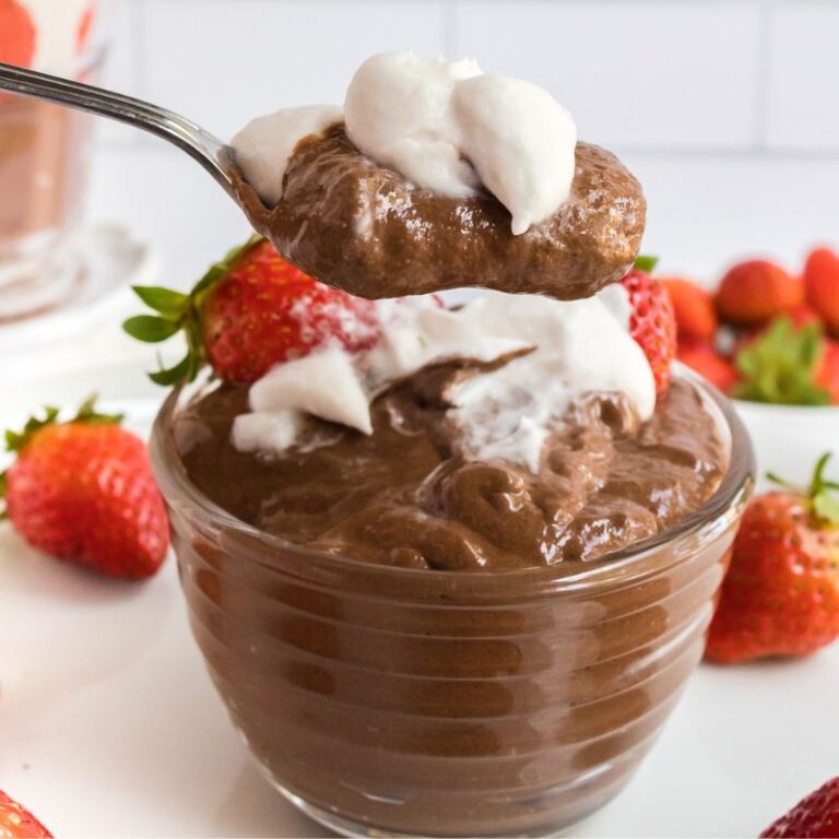 1 serving of chocolate chia pudding with coconut whipped cream and strawberries.
