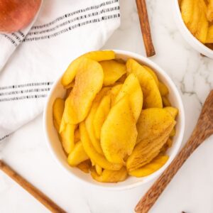 Stovetop Cinnamon apples in a white bowl.