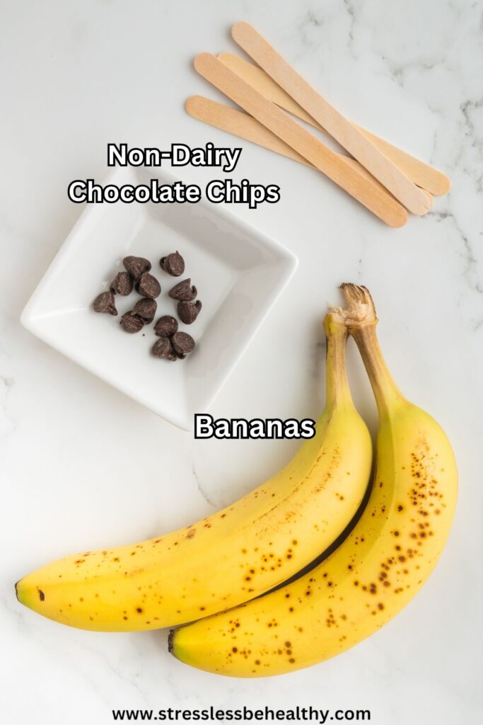 Bananas, chocolate chips, and popsicle sticks - banana ghost ingredients.