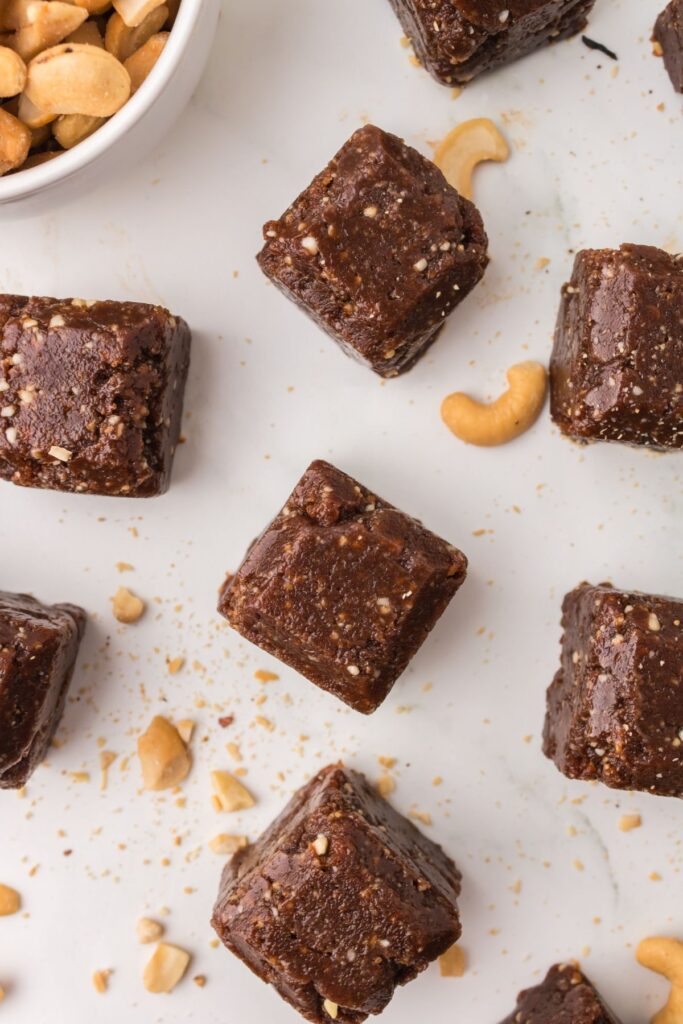 Cashew date bars, or bites, spread out.