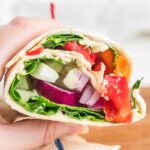 Inside view of a rainbow veggie wrap.