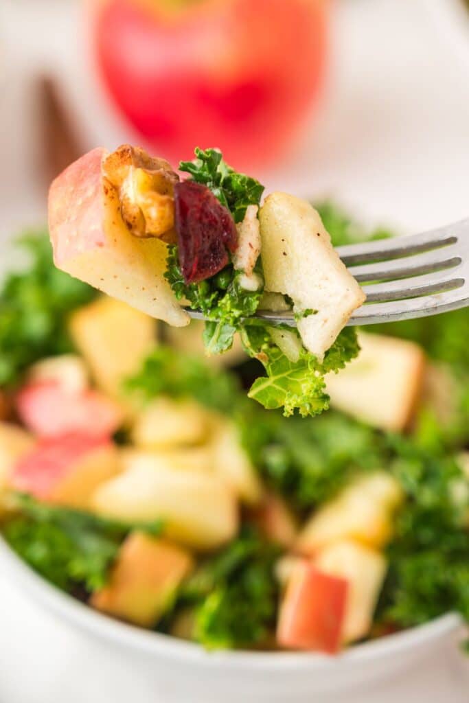 Kale Apple Salad on a fork.