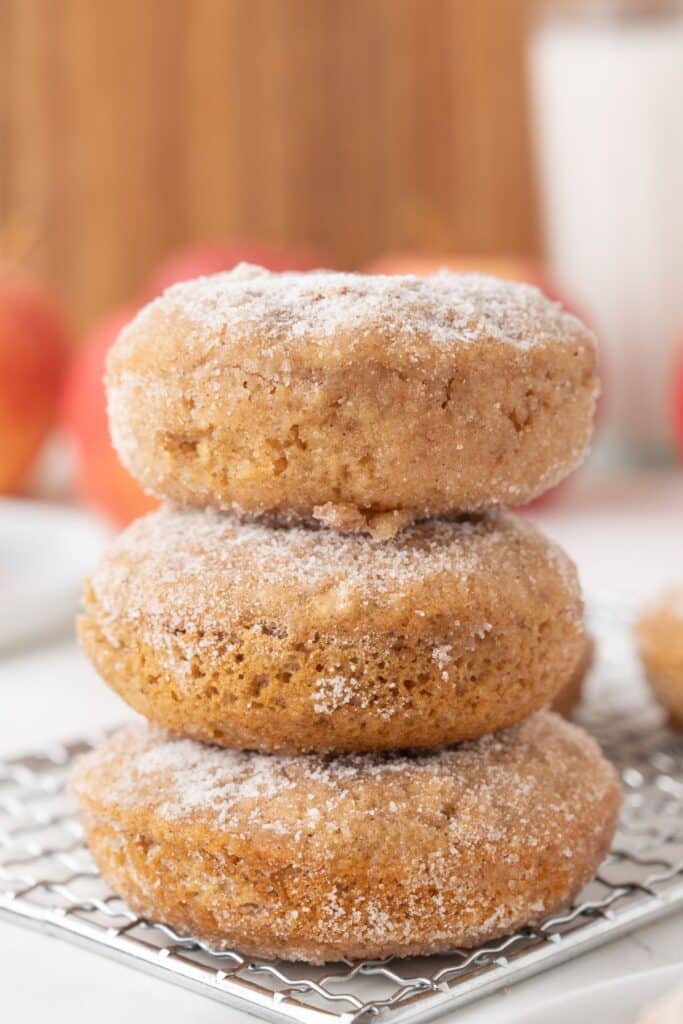 Vegan Apple Cider Donuts stacked on top of eachother.