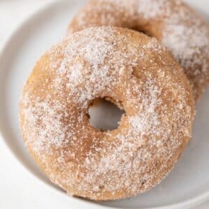 Vegan Apple Cider Donuts on a white plate.