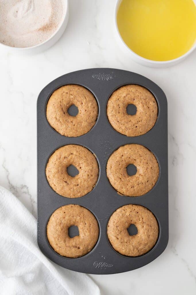 Vegan Apple Cider Donuts fresh from the oven, still in the baking tray.
